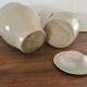 2 enamelled sandstone pots