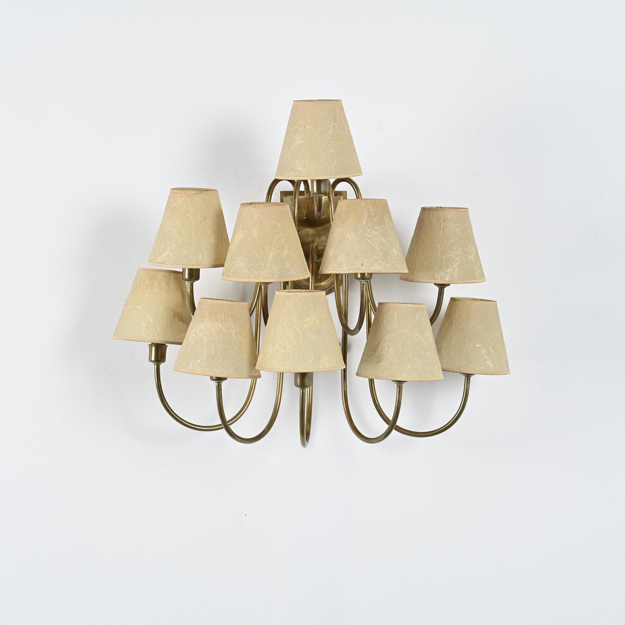 Wall sconce with nine arms in brass, France, circa 1950.