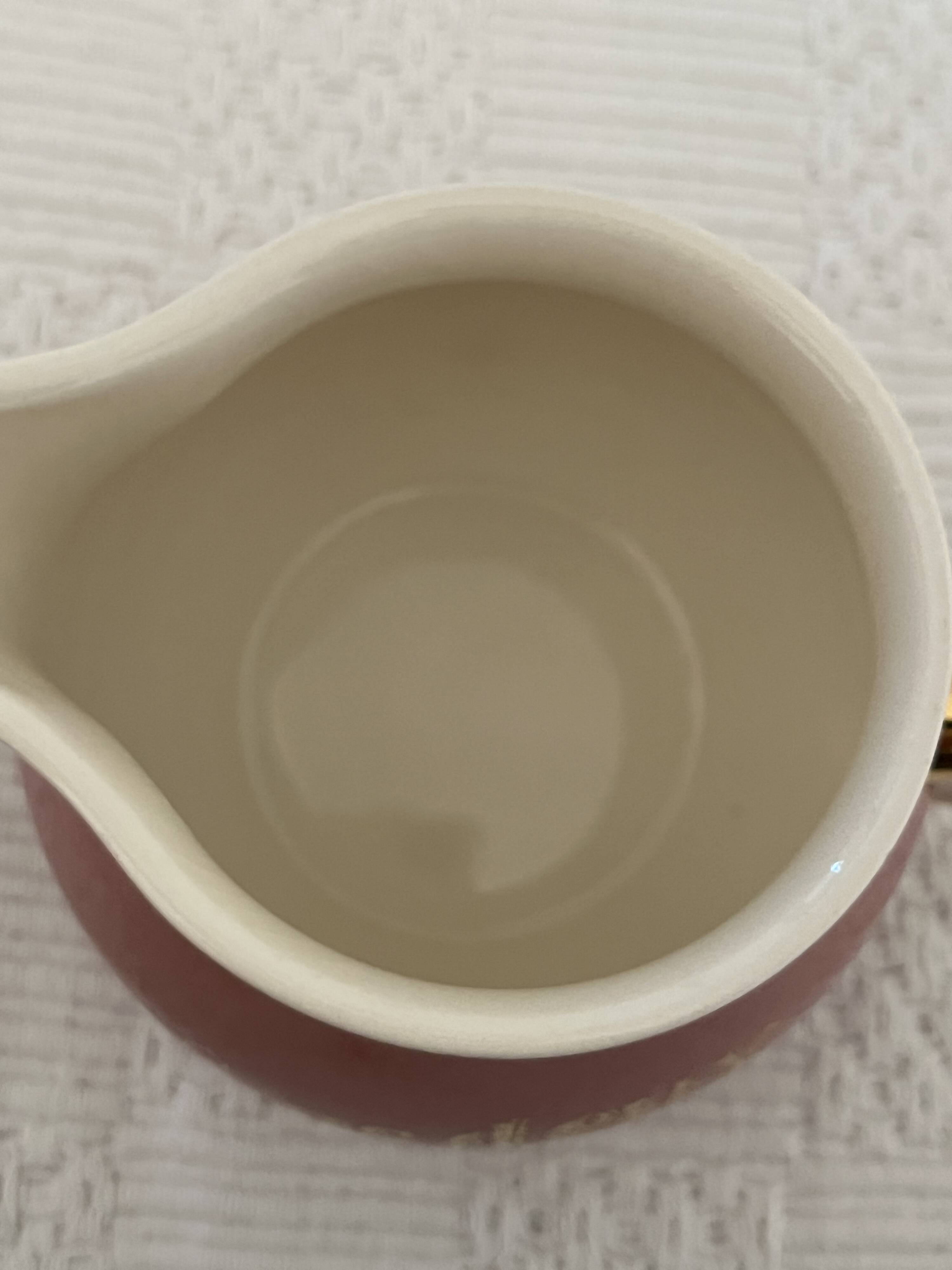 Milk jug and saucer set We Two
