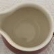 Milk jug and saucer set We Two