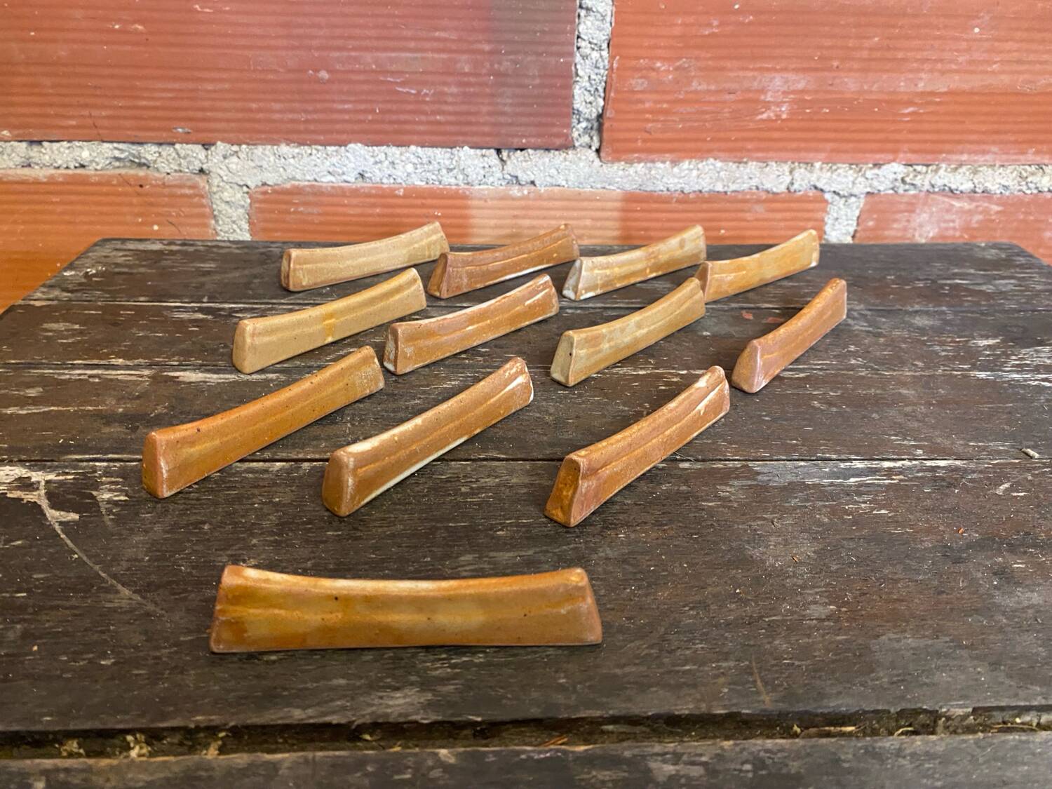 Set of 12 vintage stoneware knife rests