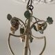 Lustre à bougies en fer forgé avec fleurs
