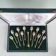12 gilt metal teaspoons