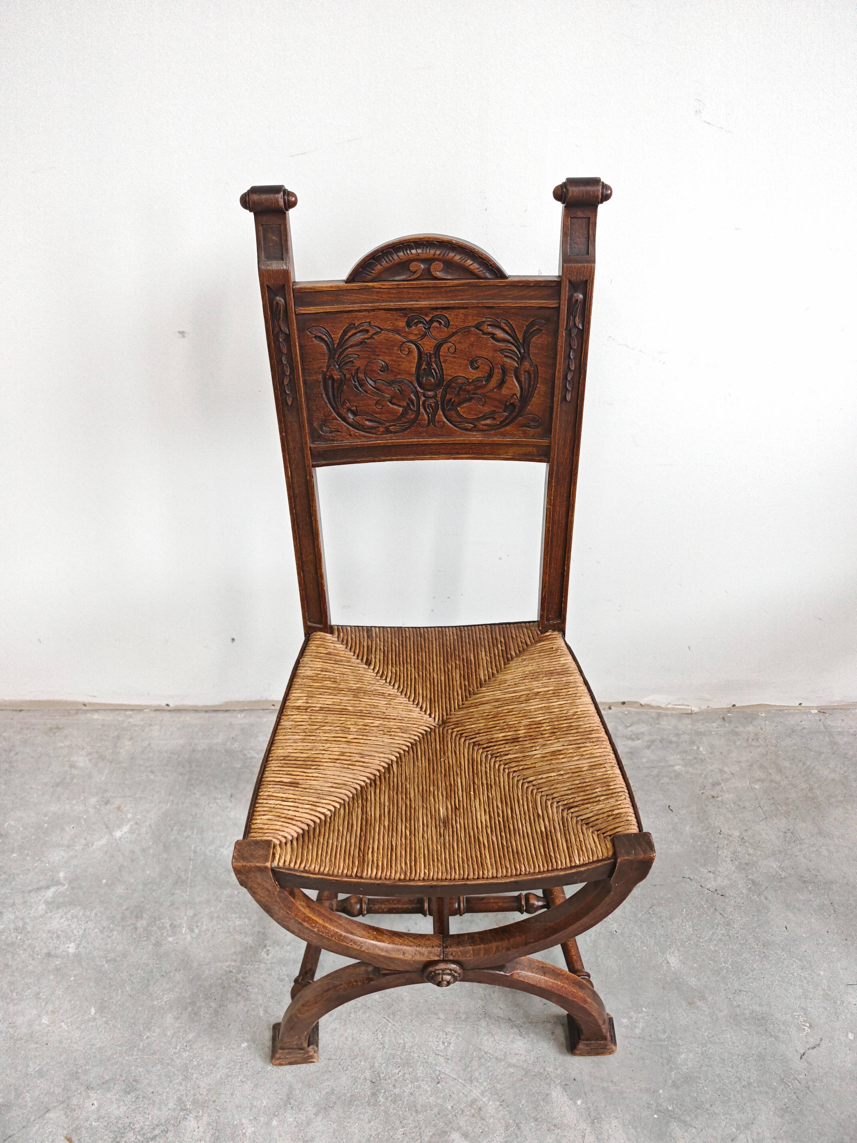 Pair of Neo-Renaissance oak chairs with straw seats, 1910
