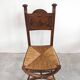 Pair of Neo-Renaissance oak chairs with straw seats, 1910
