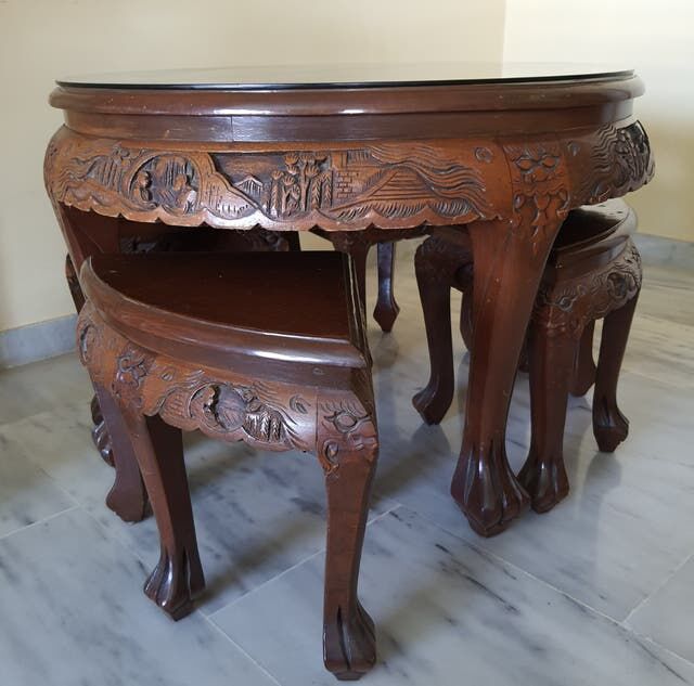 Carved coffee table and 4 built-in stools