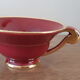 Tea, coffee and sugar cups made of red and gold porcelain
