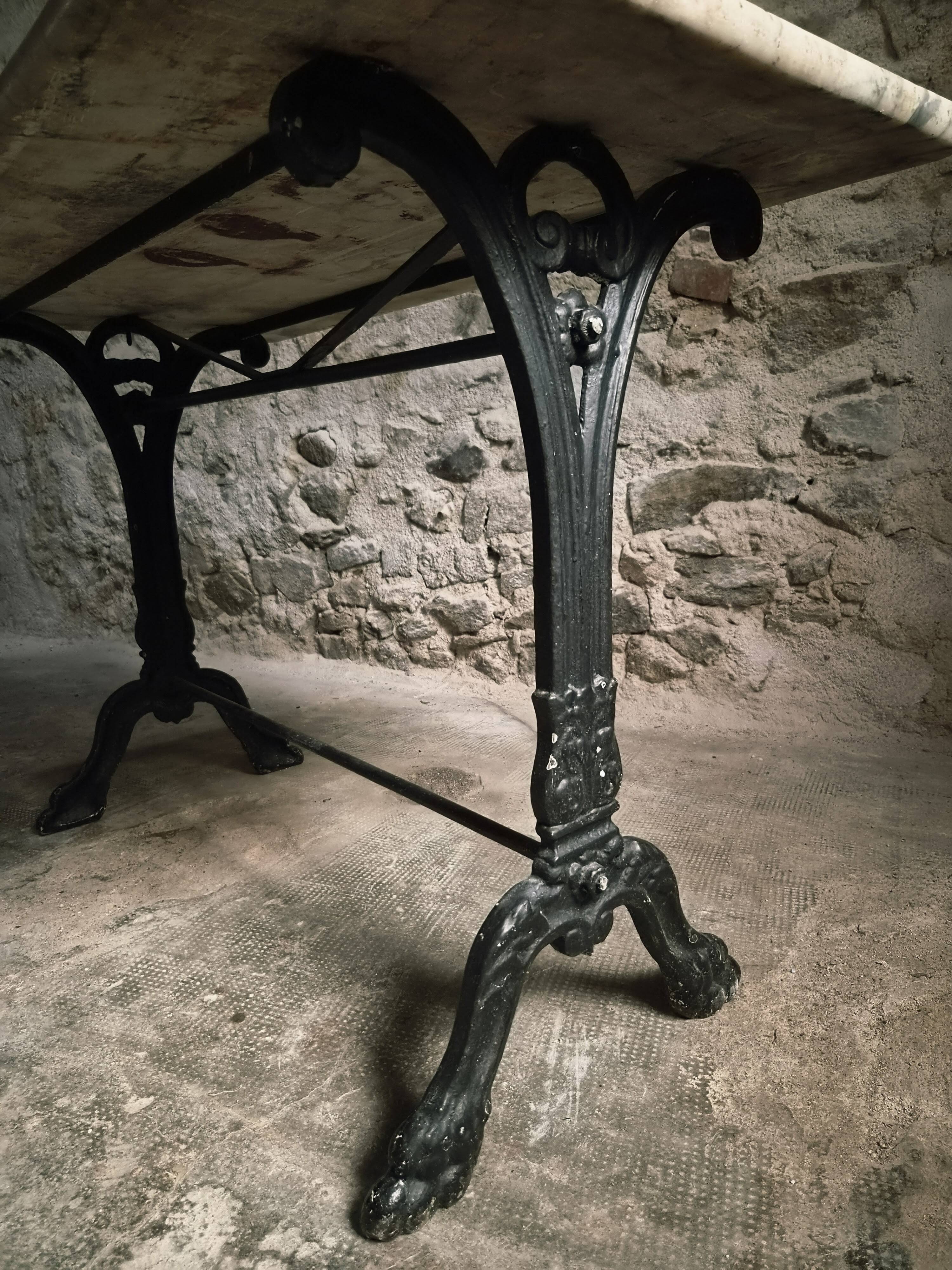 French bistro table made of marble with a cast iron base, 1920s–1930s.