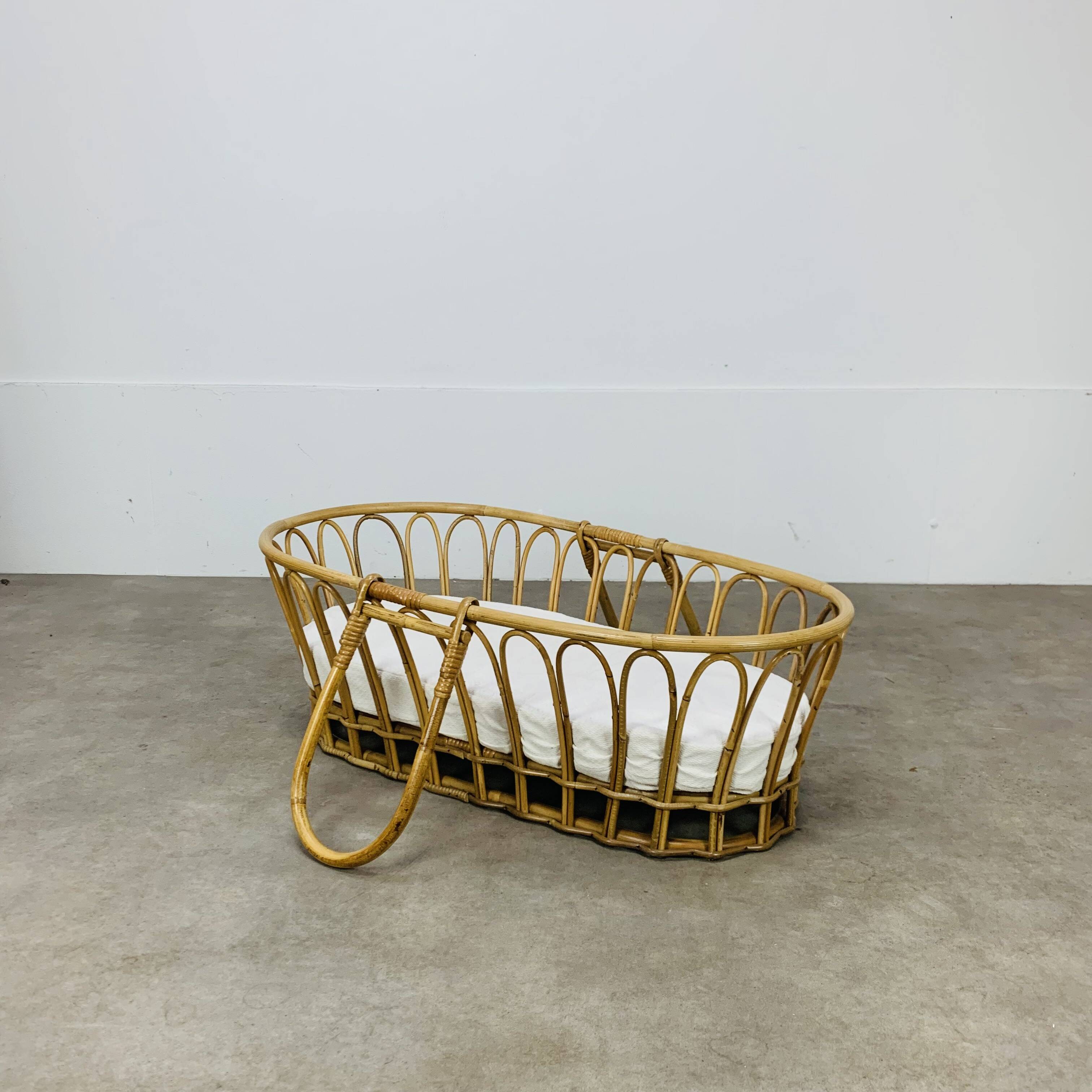 Vintage rattan baby bassinet