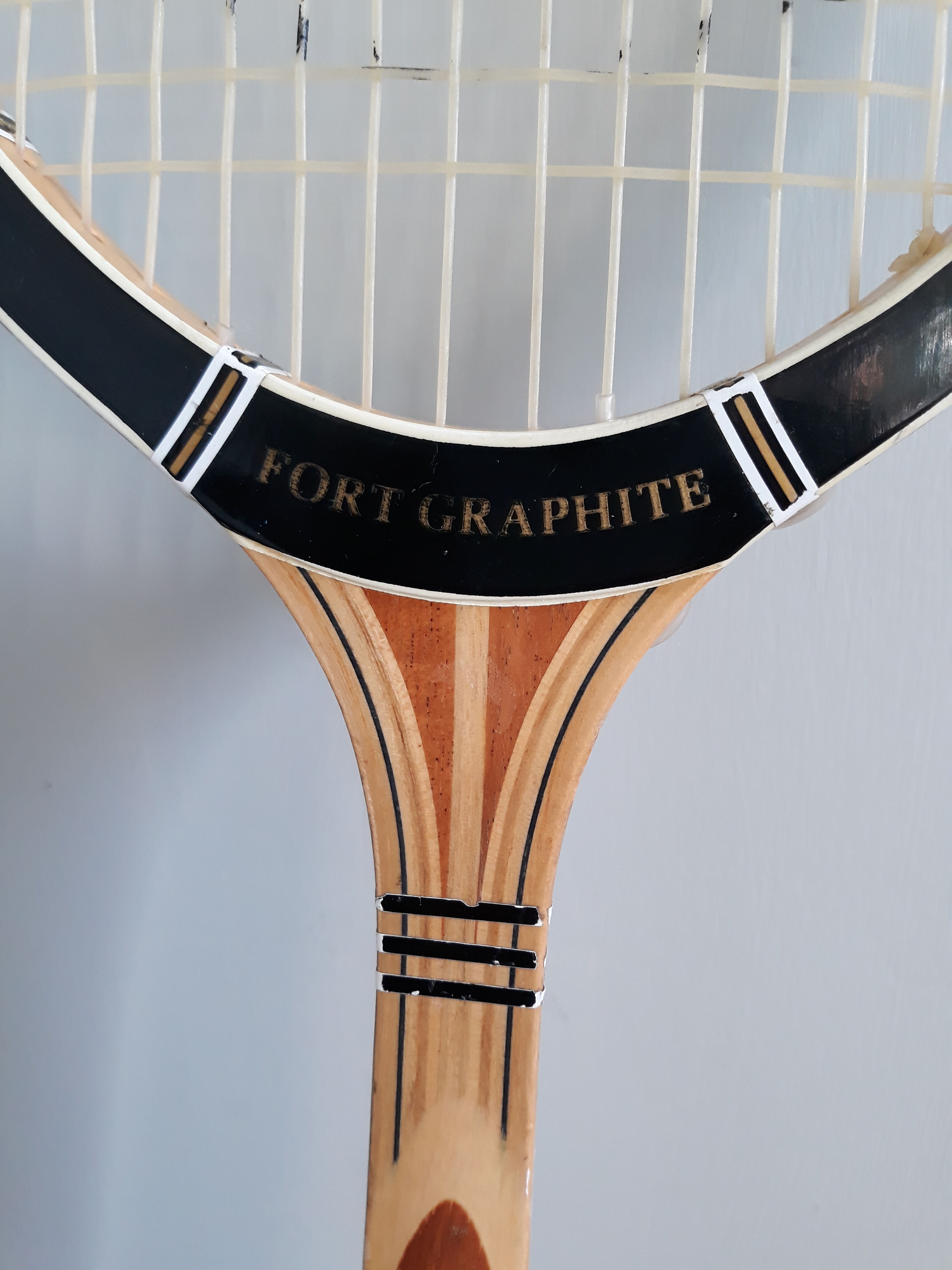 Wooden Dunlop tennis racket with its cover