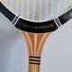Wooden Dunlop tennis racket with its cover