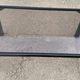 Black tubular coffee table with smoked glass by Yves Boutboul, 1980.
