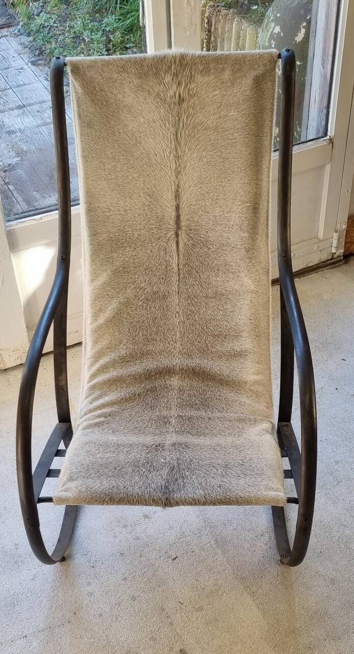 Wrought iron and skin armchair