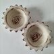 Duo of handmade beige and terracotta earthenware empty pockets