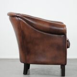 Great luxurious brown cowhide club armchair with matching piping
