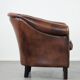 Great luxurious brown cowhide club armchair with matching piping