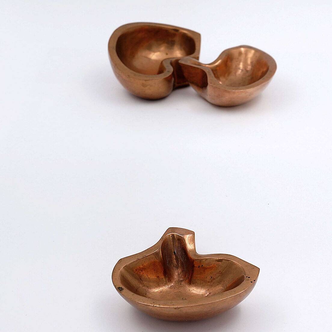 Empty Pockets in polished bronze Margrit van Nuffel 1970, set of 3