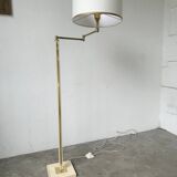 Floor lamp with articulated arm in brass-plated metal