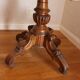 Large walnut guéridon with a sculpted base.