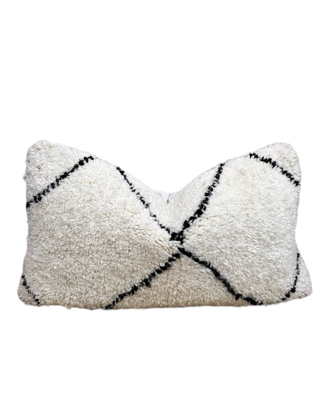 Bohemian wool pillow cover on a Beni Ourain Berber cushion. The cushion cover