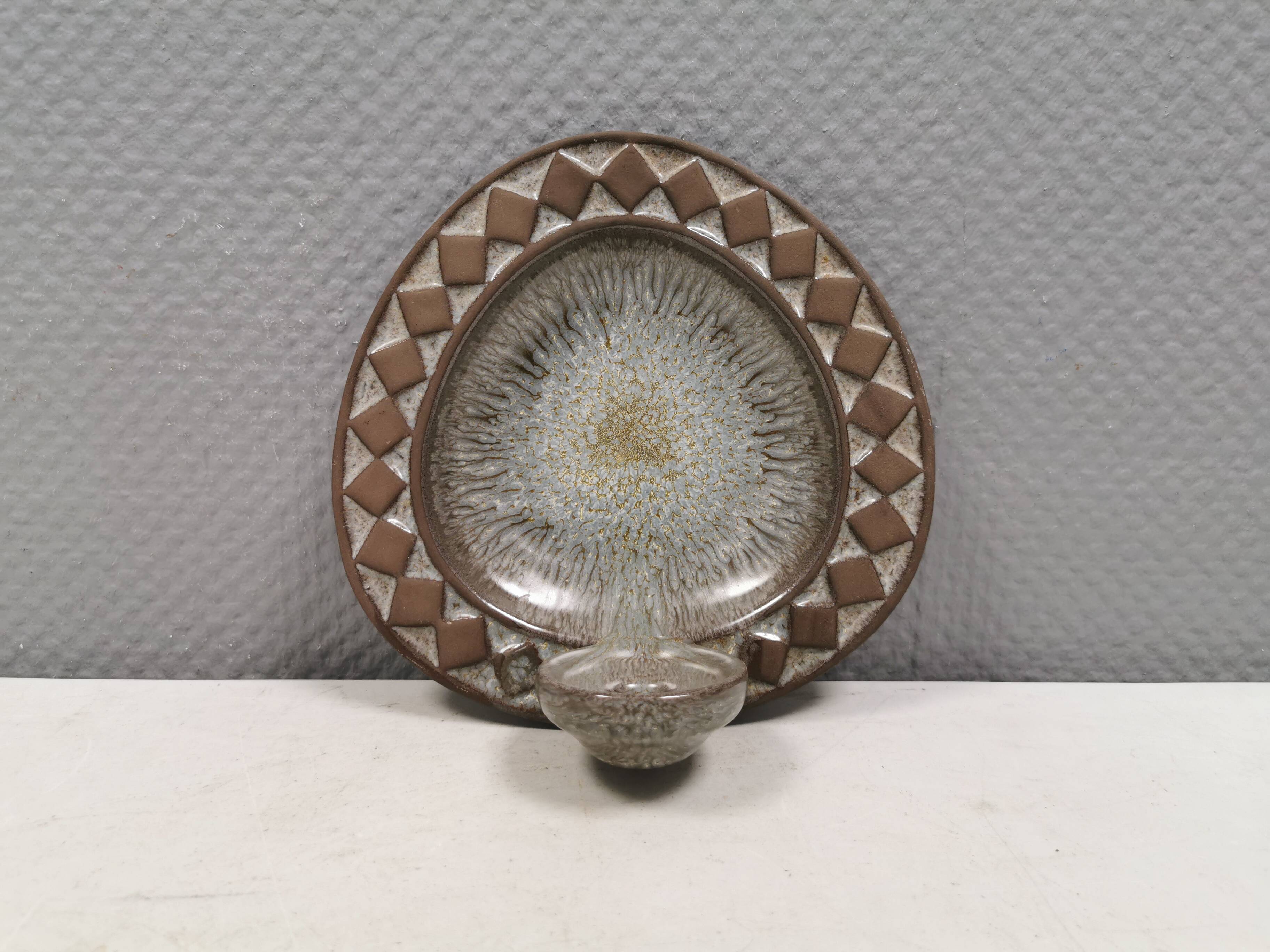 Wall-mounted candlestick in grayish colors, Danish and from the 1970s-80s.