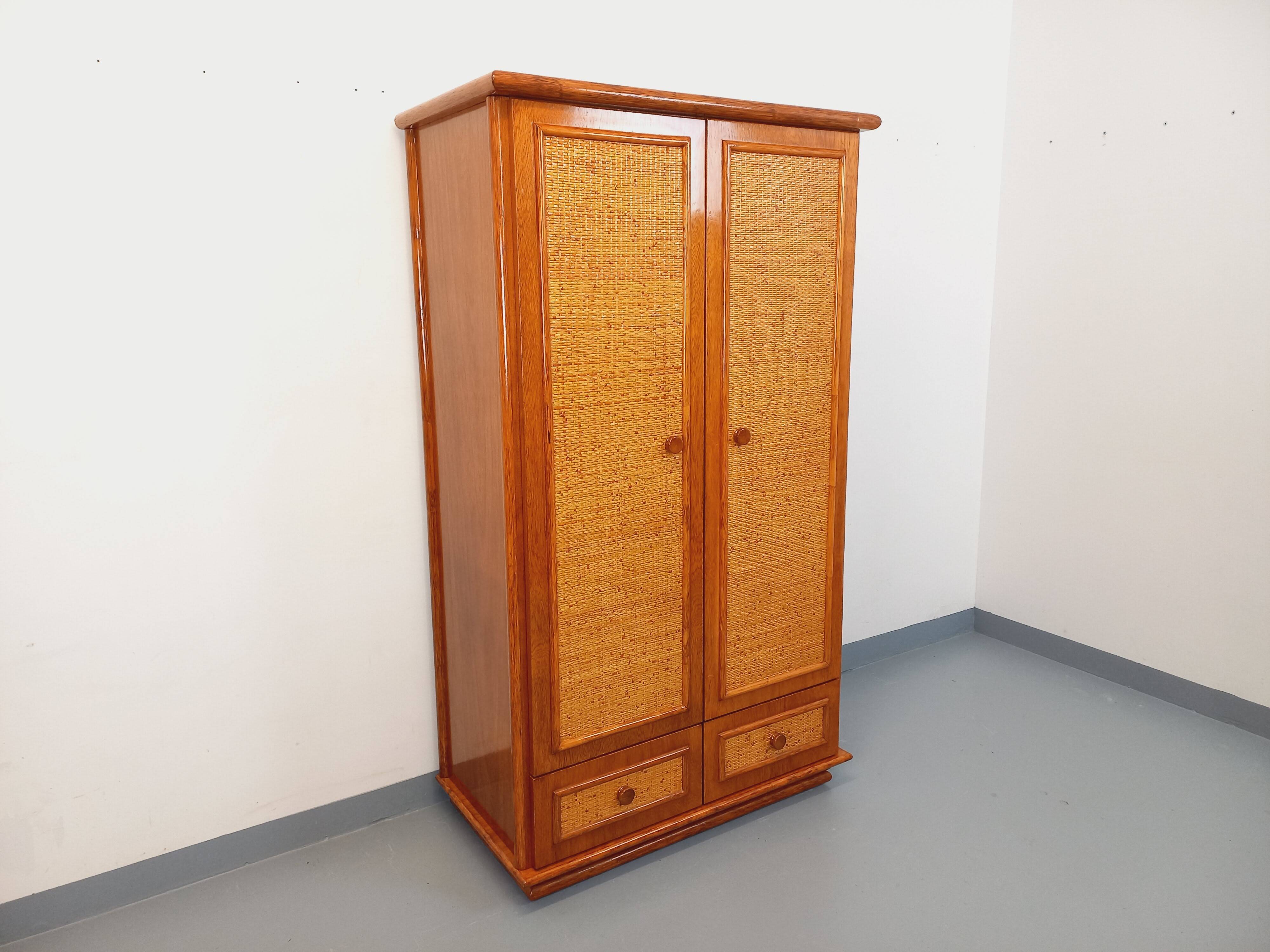 Vintage woven rattan and wood armoire by Maugrion for Roche-Bobois.