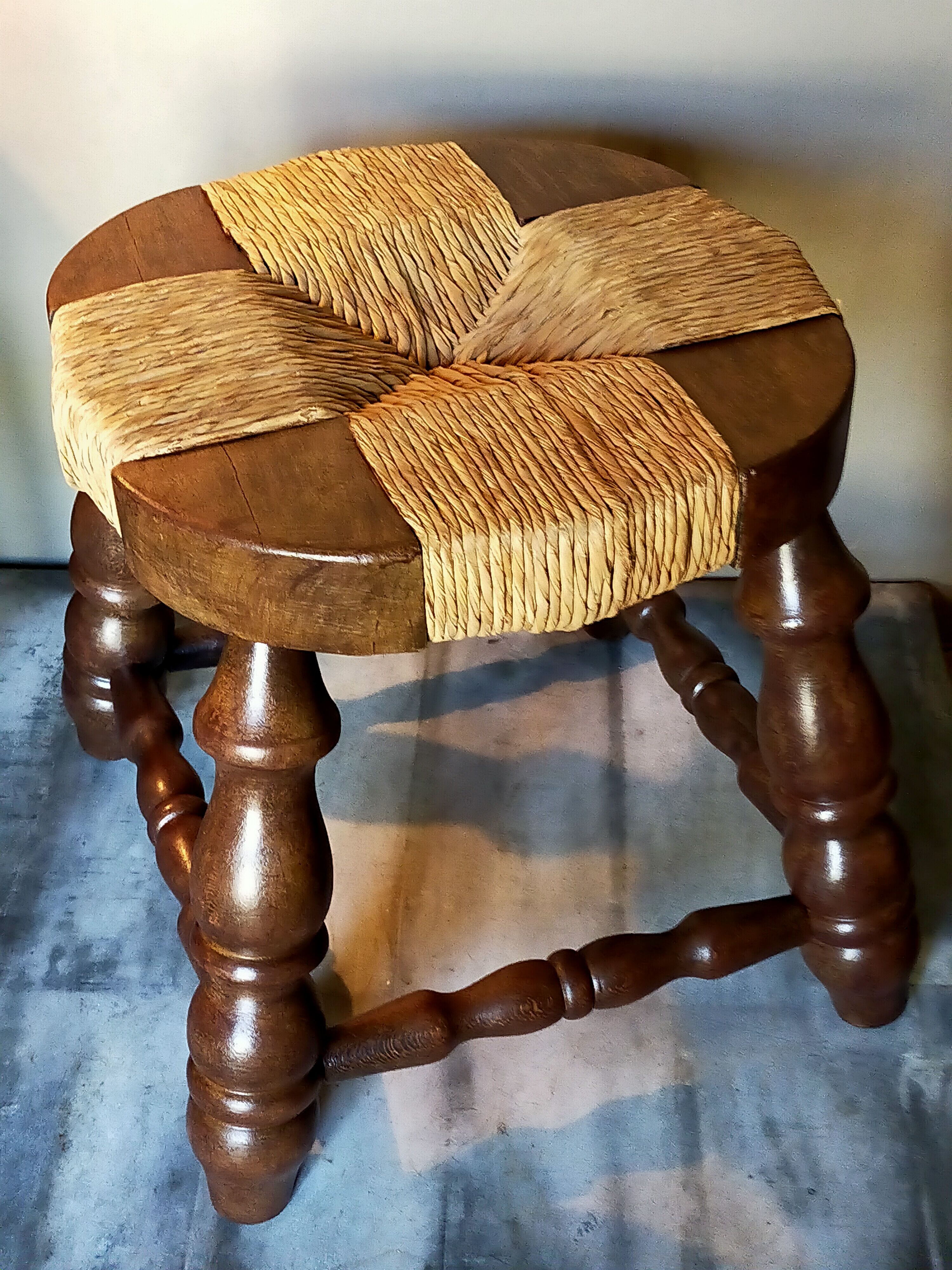Low vintage regional stool in solid wood with straw top