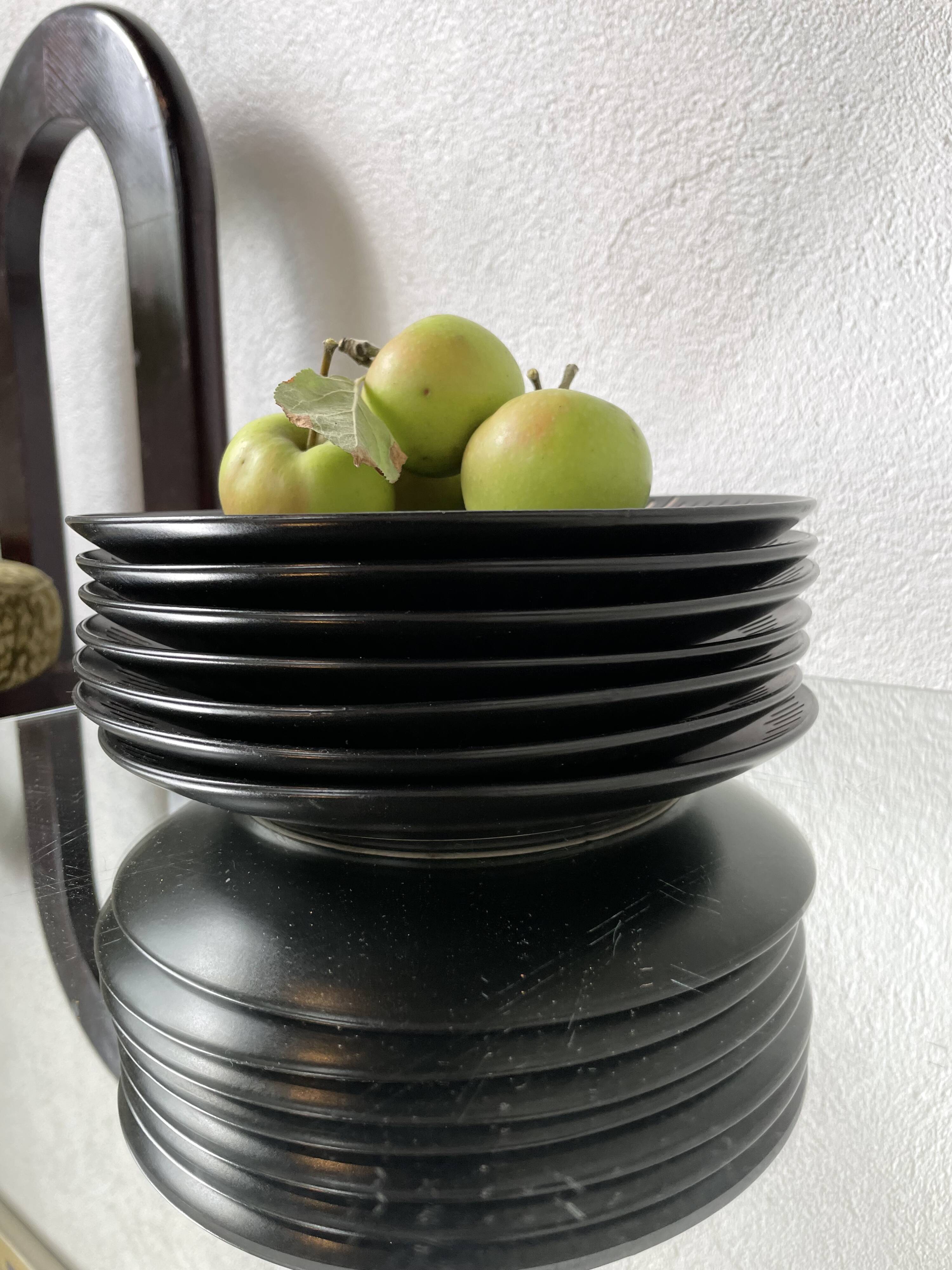 7 black ceramic plates