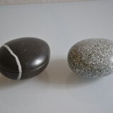 2 boxes in lithographed sheet metal in the shape of a pebble