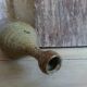 Bottled sandstone vase with a narrow neck