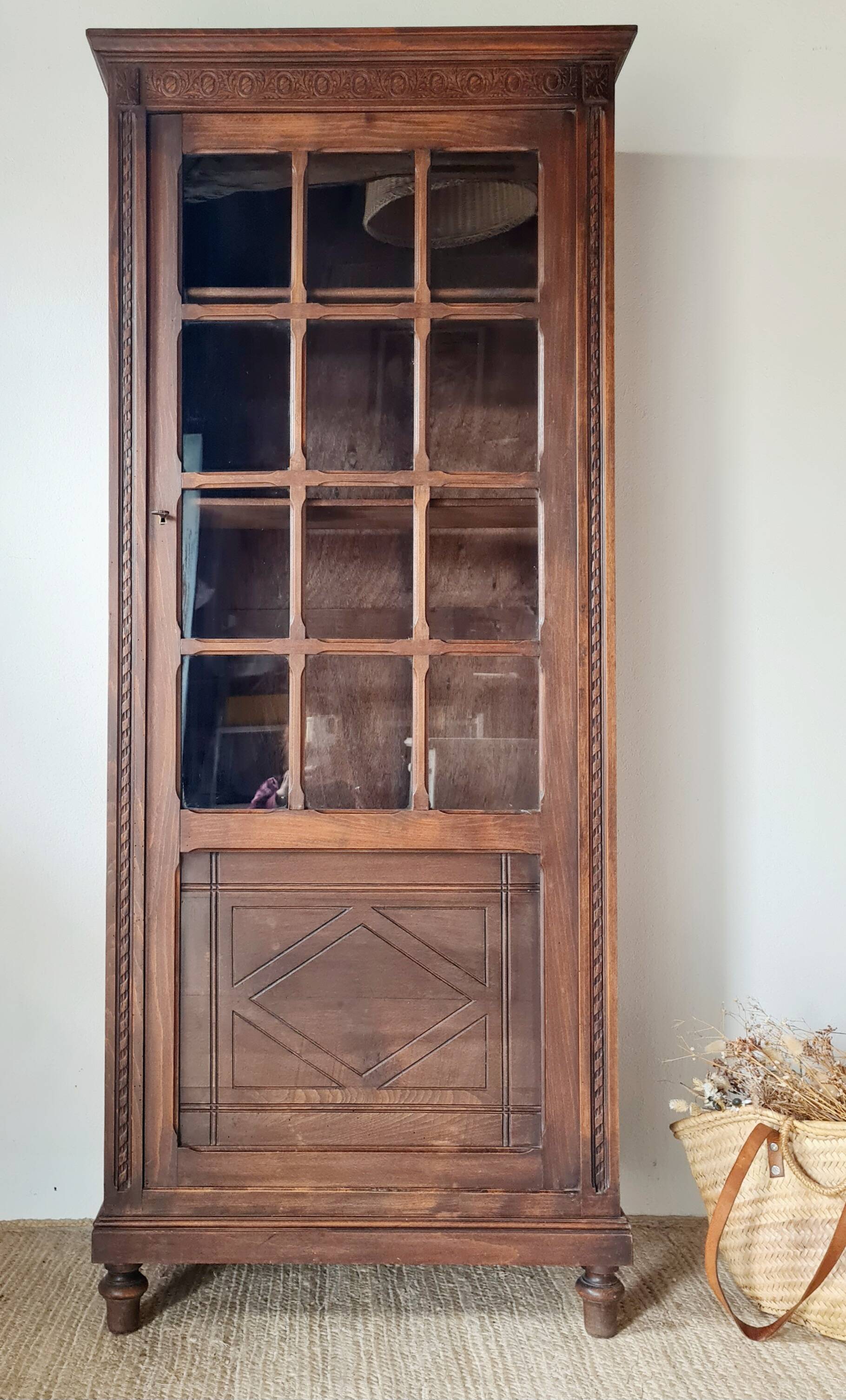 Old glass-fronted library in solid wood