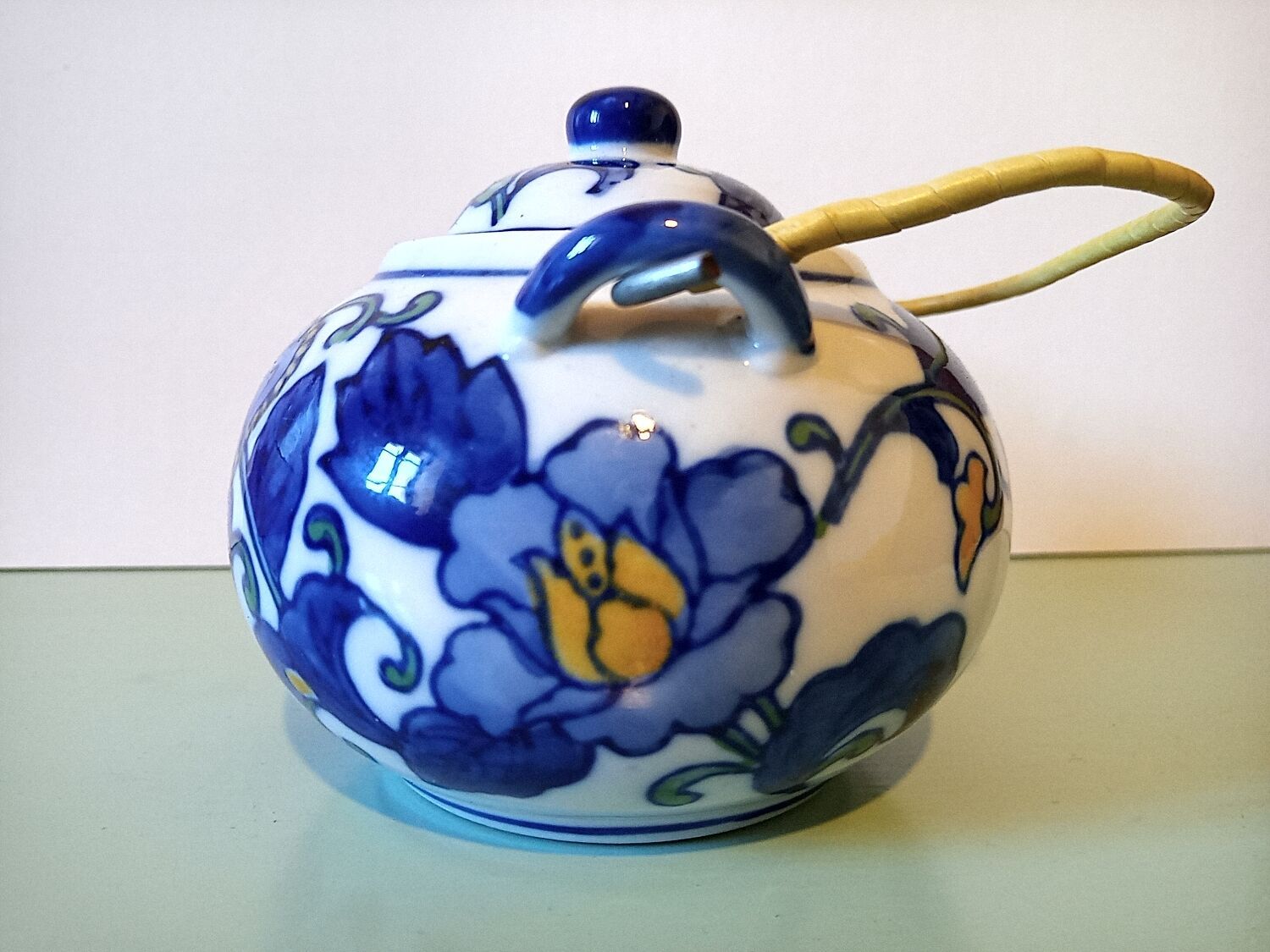 Hand-painted blue floral pattern teapot