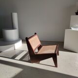 Reclined armchair in canned teak in natural wood