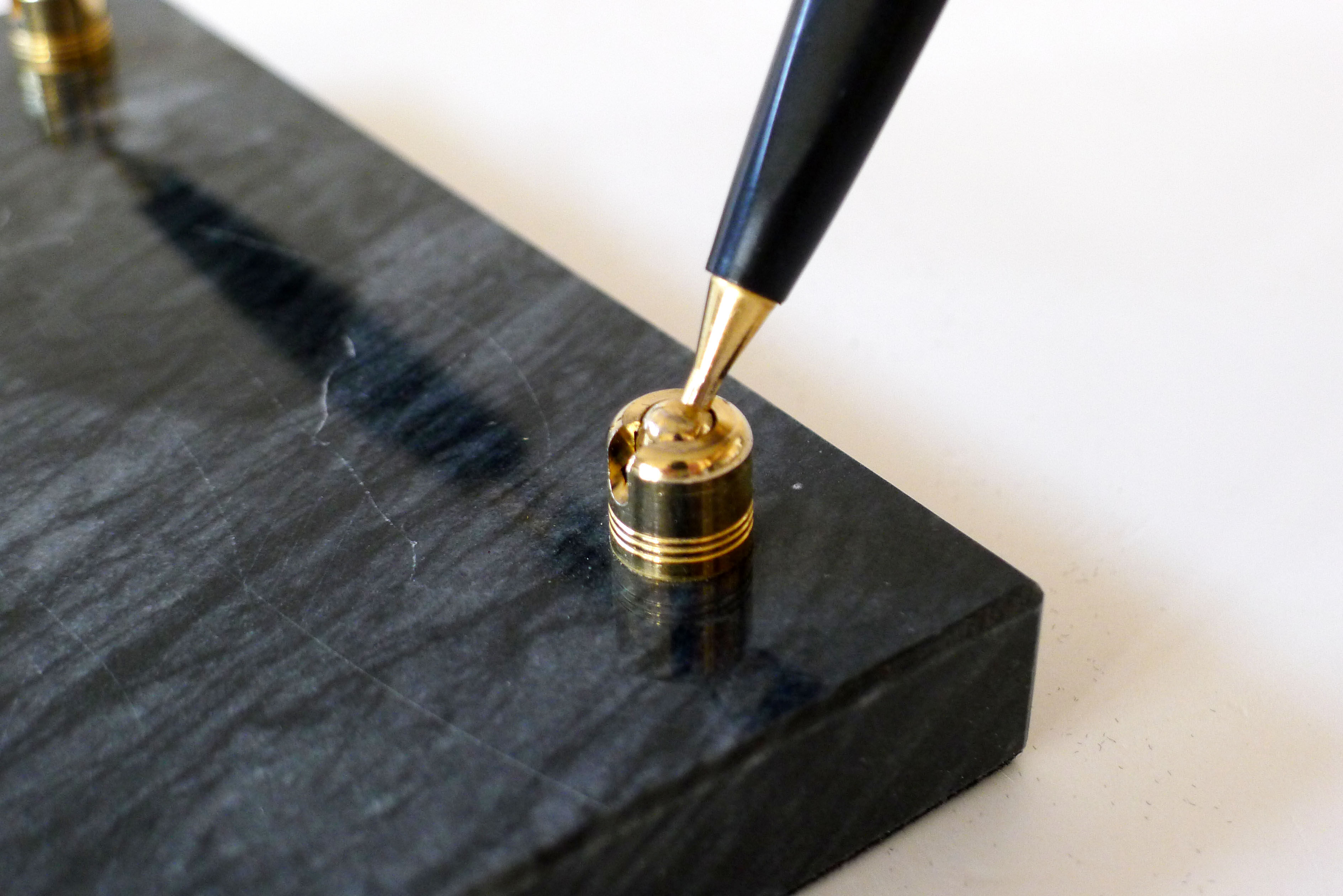 Pen doors on marble base