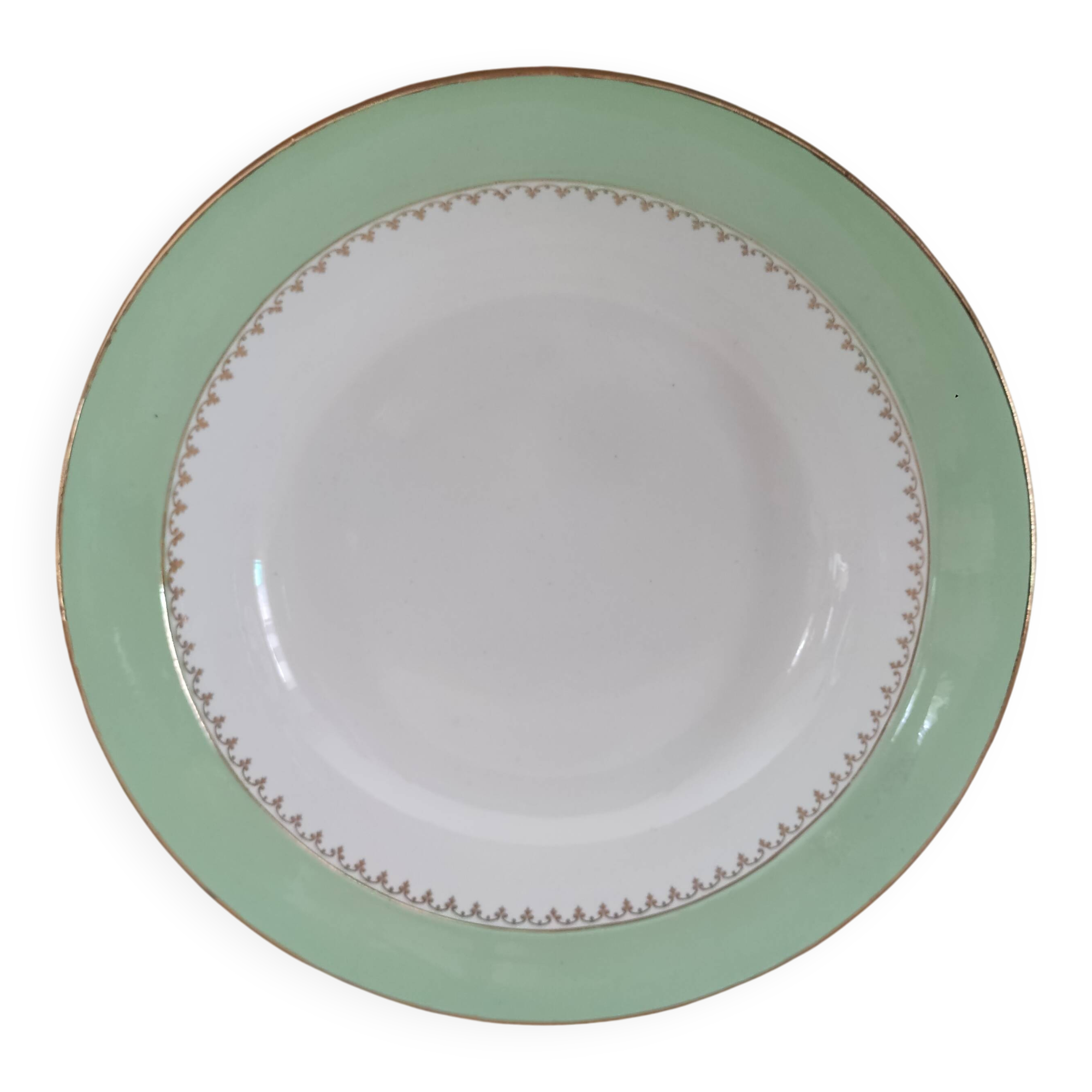 Round hollow plate in water green with a golden frieze, Cafés Lemaire.