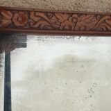 Art Deco door mirror with floral pattern frame