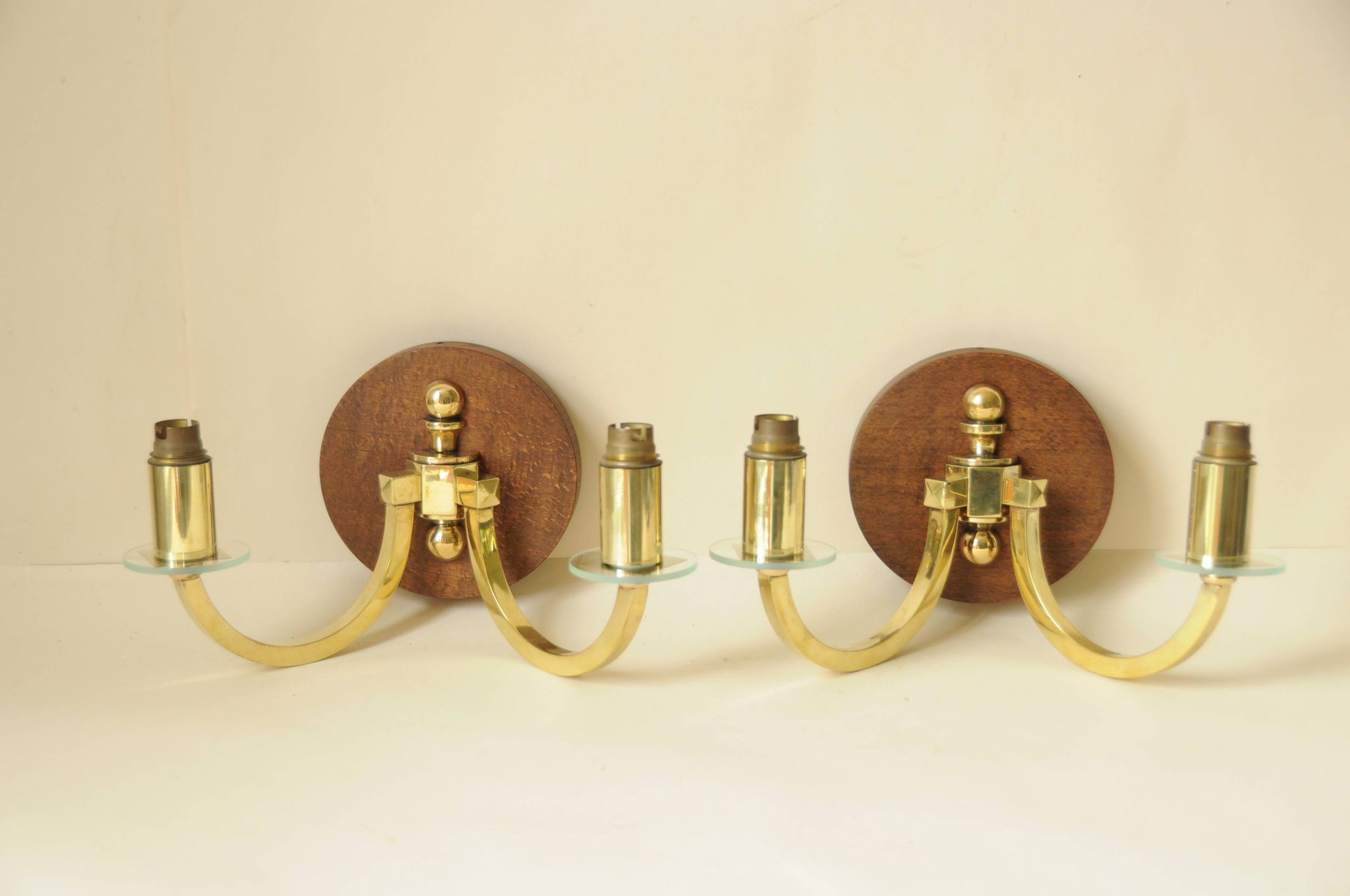 Pair of vintage wall sconces in polished gold brass, wood and glass