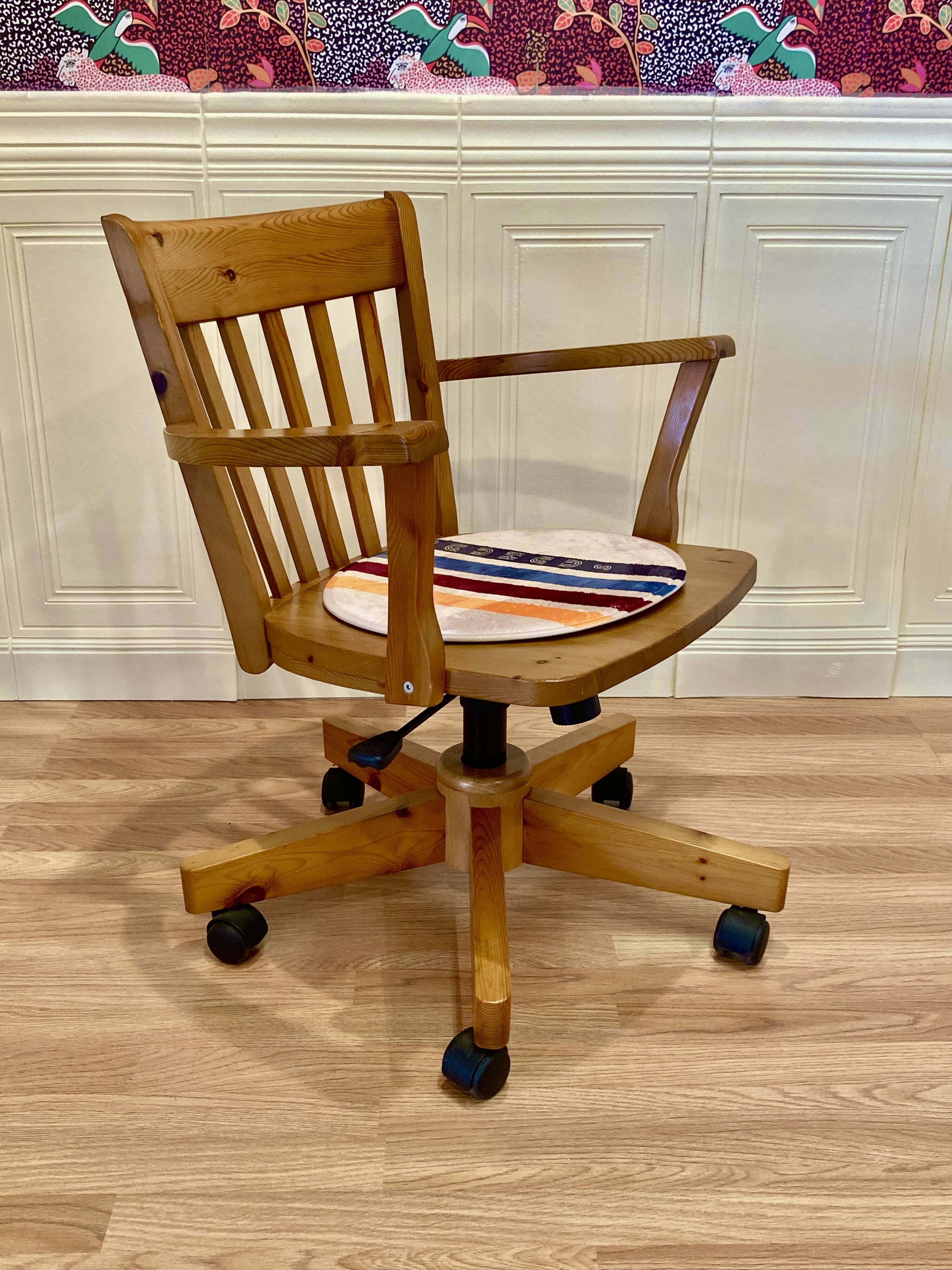 Solid wood swivel and reclining armchair.
