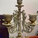 Fireplace trim clock and adornment of antique bronze candelabra