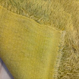 Large handmade wool rug from the 70s in lime green.