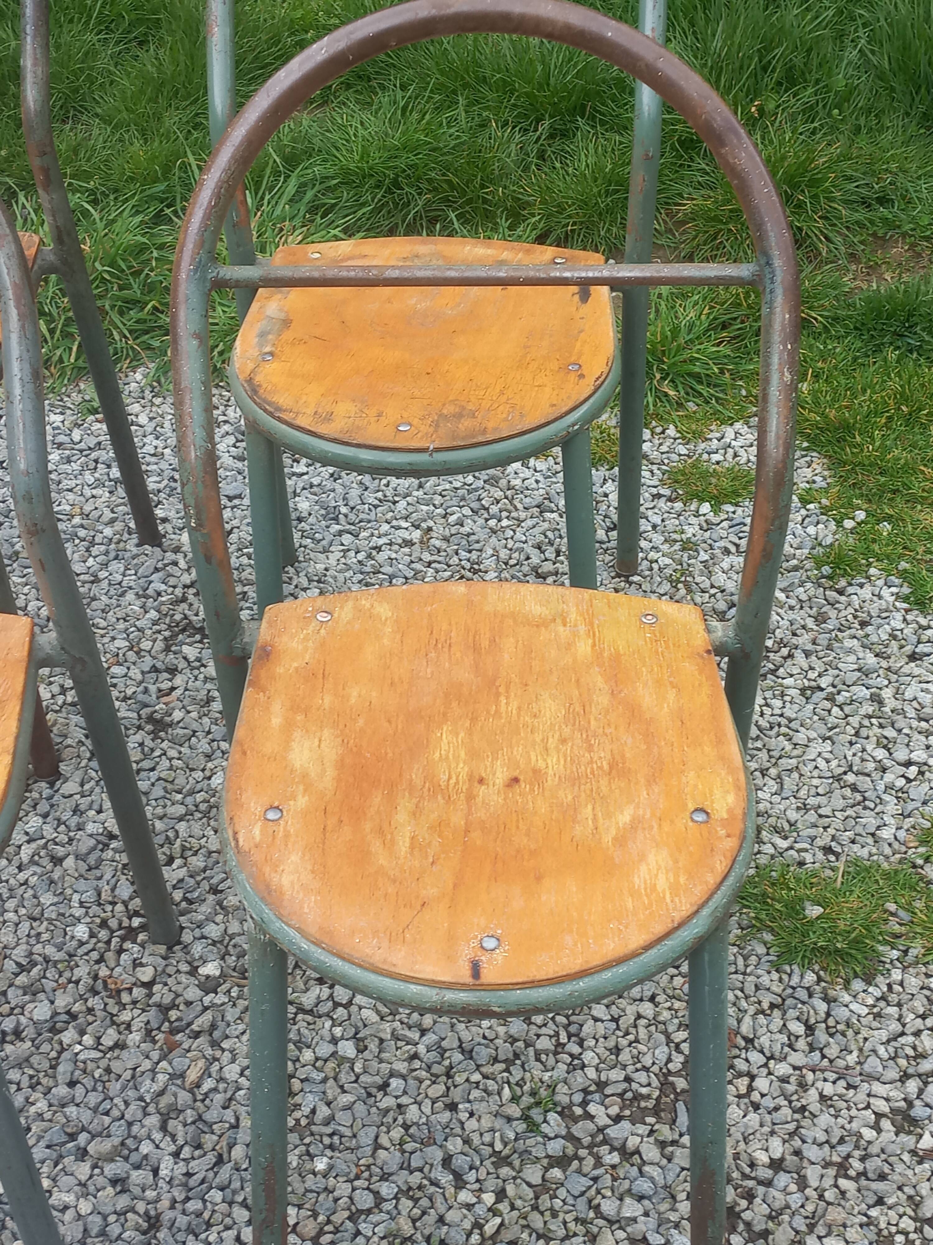 Set de 7 chaises de René Herbst métalliques assises bois