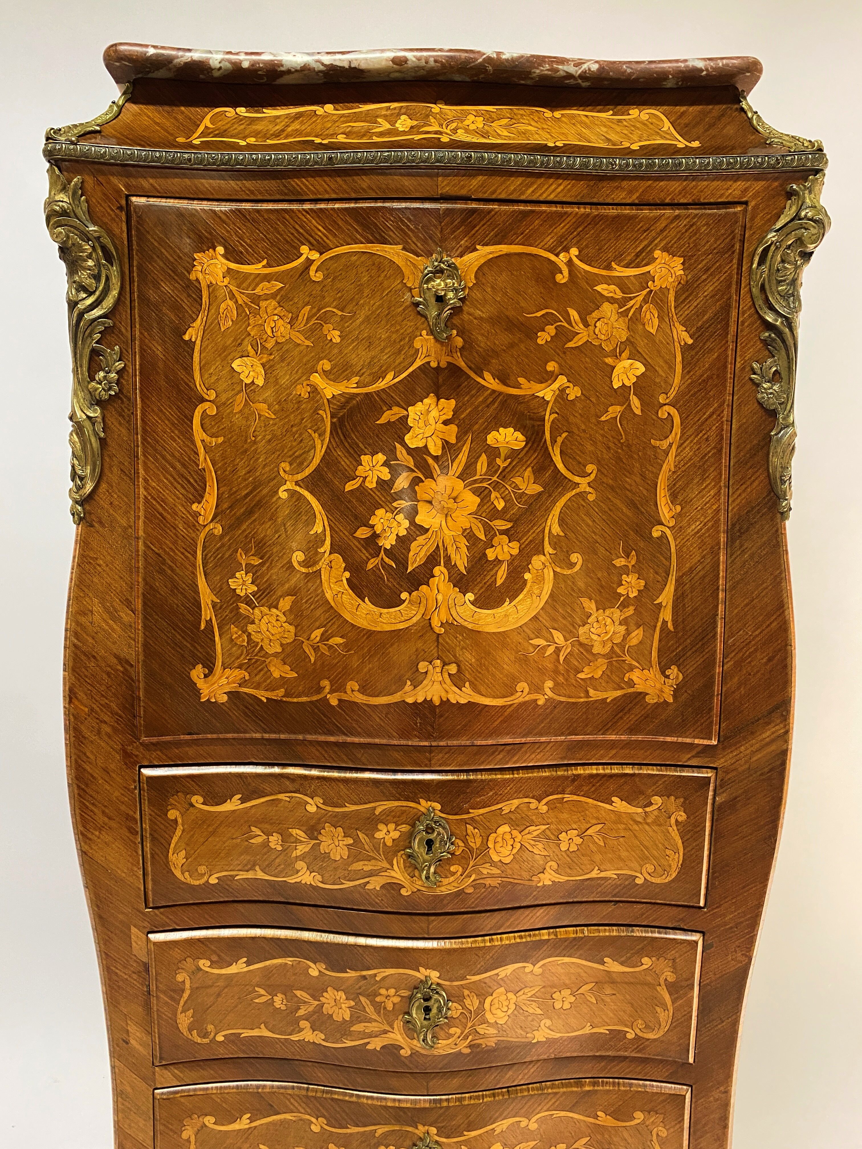 Curved secretary and inlaid with floral branches in Louis XV style