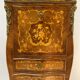 Secrétaire galbé et marqueté de branchages fleuris de style Louis XV