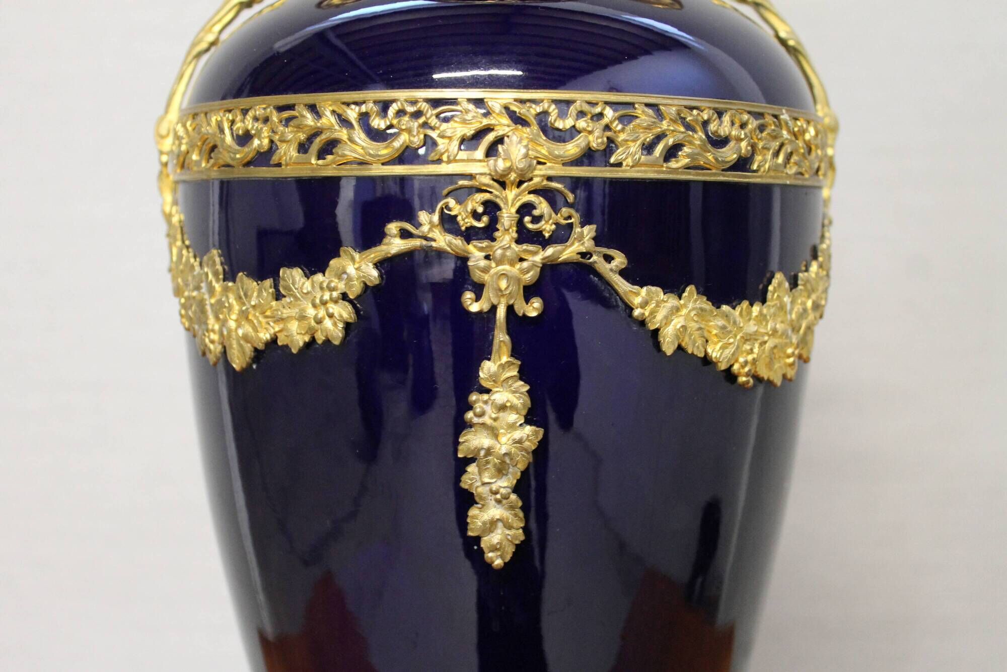 Vase signed Legastelois in blue ceramic of Sèvres and gilded bronze
