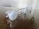 White lacquered metal wall coat rack with 3 hooks, 1980