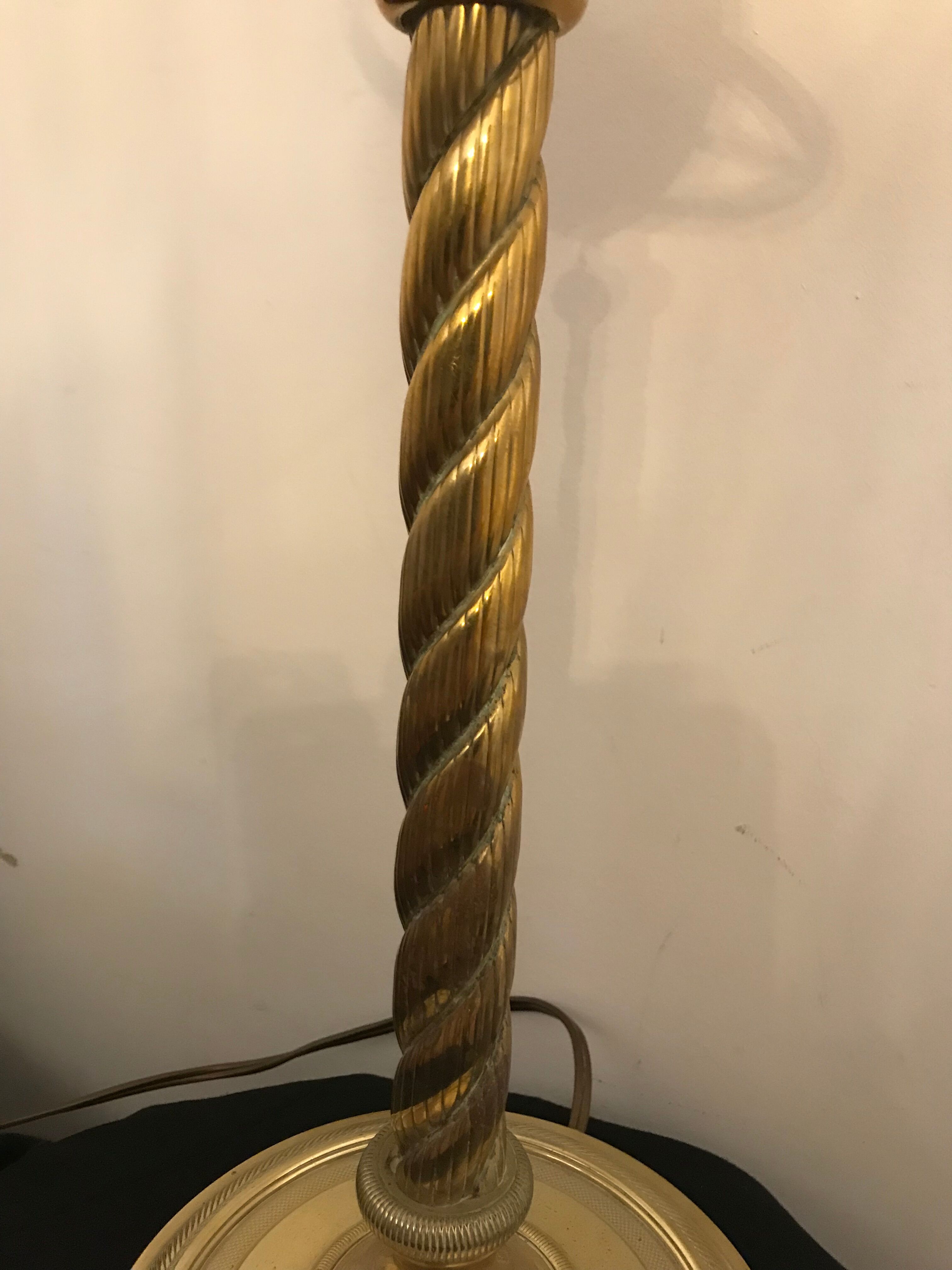 Brass lamp with removable ring around a globe