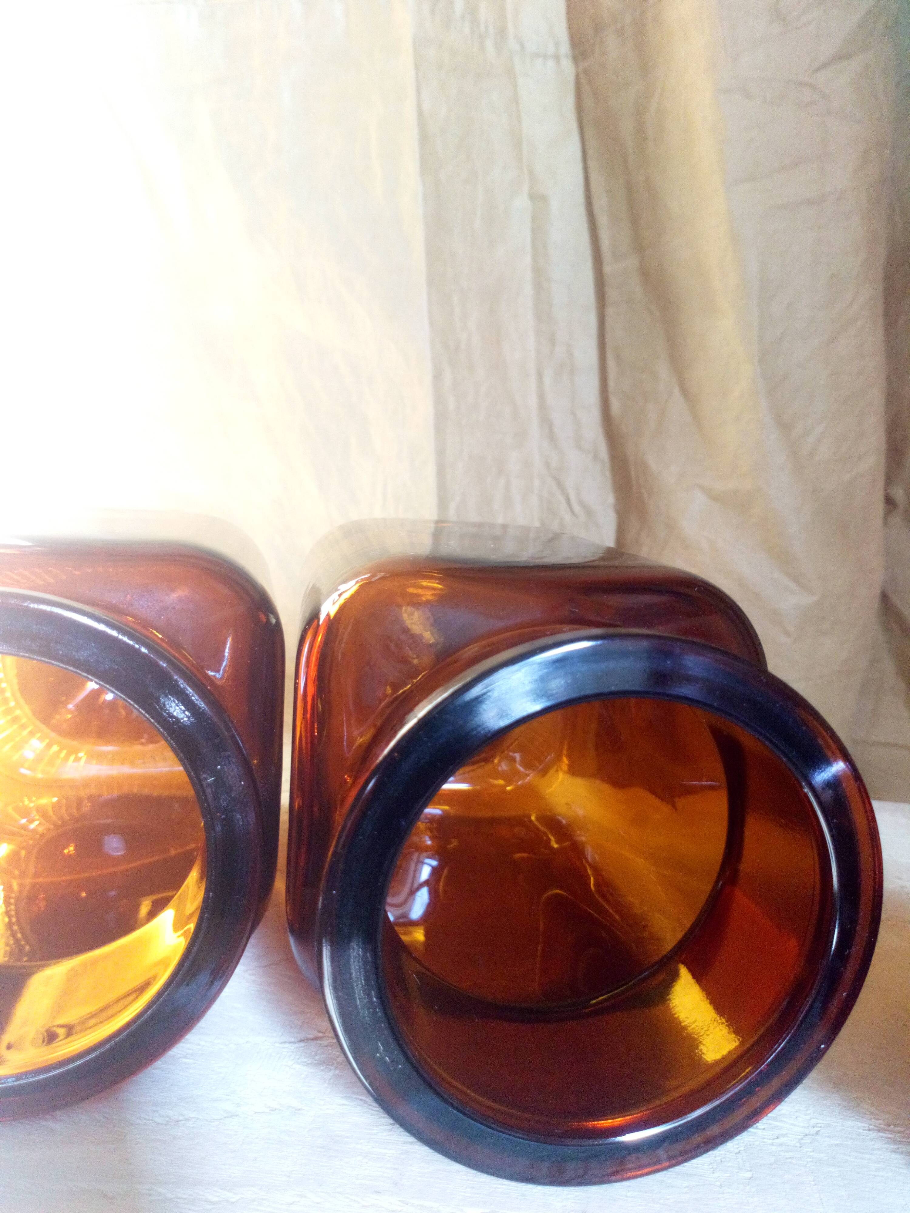 Duo of vintage apothecary bottles in amber glass