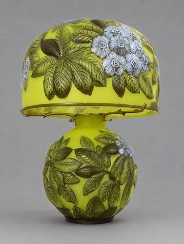 Table lamp in multilayer glass paste, adorned with a rich floral decoration.
