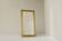 Large Art Deco mirror in patinated brass with faceted glass from the 1960s.