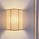Cream jute wall sconces and bronze velvet trims
